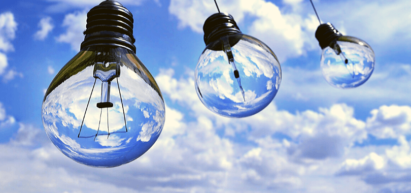 Three light bulbs hanging in the sky.